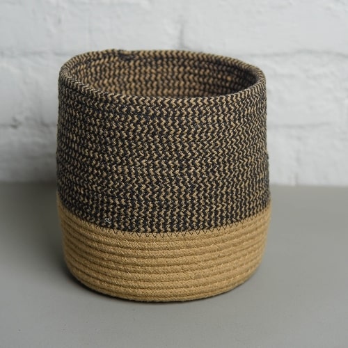 Single basket in the Black Basket Set, a set of 3 black jute & cotton baskets you can buy online at Sukham Home, a sustainable furniture, kitchen & dining and home decor store in Kolkata, India