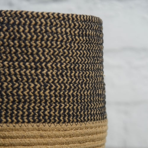 Close up of the basket in the Black Basket Set, a set of 3 black jute & cotton baskets you can buy online at Sukham Home, a sustainable furniture, kitchen & dining and home decor store in Kolkata, India