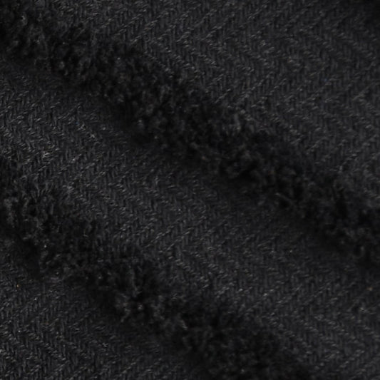Close up of the tufted texture and weaving on the Black Tufted Throw with Cushion Cover you can buy online at Sukham Home, a sustainable furniture, kitchen & dining and home decor store in Kolkata, India