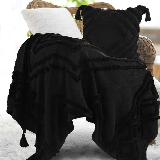 Placed on a chair, the Black Tufted Throw with Cushion Cover you can buy online at Sukham Home, a sustainable furniture, kitchen & dining and home decor store in Kolkata, India
