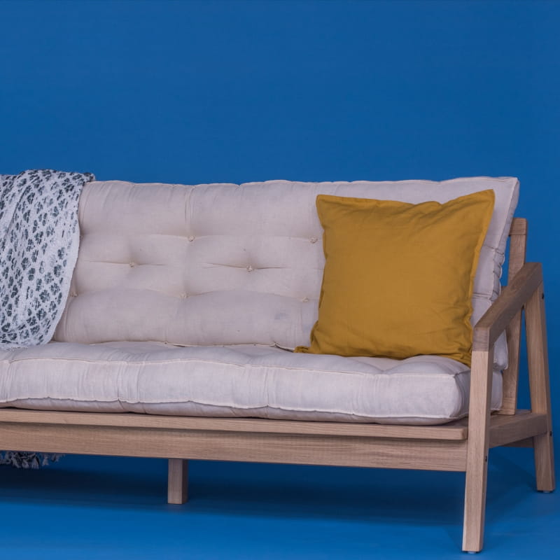 Arms of the Bliss Sofa, a wooden cushioned midcentury sofa you can buy online at Sukham Home, a sustainable furniture, kitchen & dining and home decor store in Kolkata, India