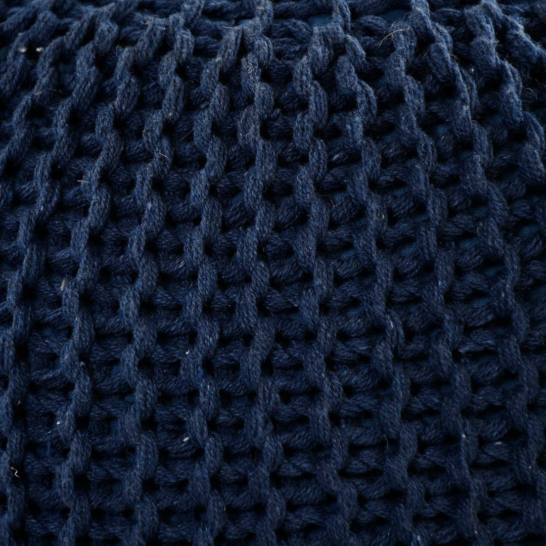 Close up of the texture of the fabric on the Blue Knitted Pouf, a navy blue ottoman made from cotton, available at Sukham Home, a sustainable furniture, kitchen & dining and home decor store in Kolkata, India