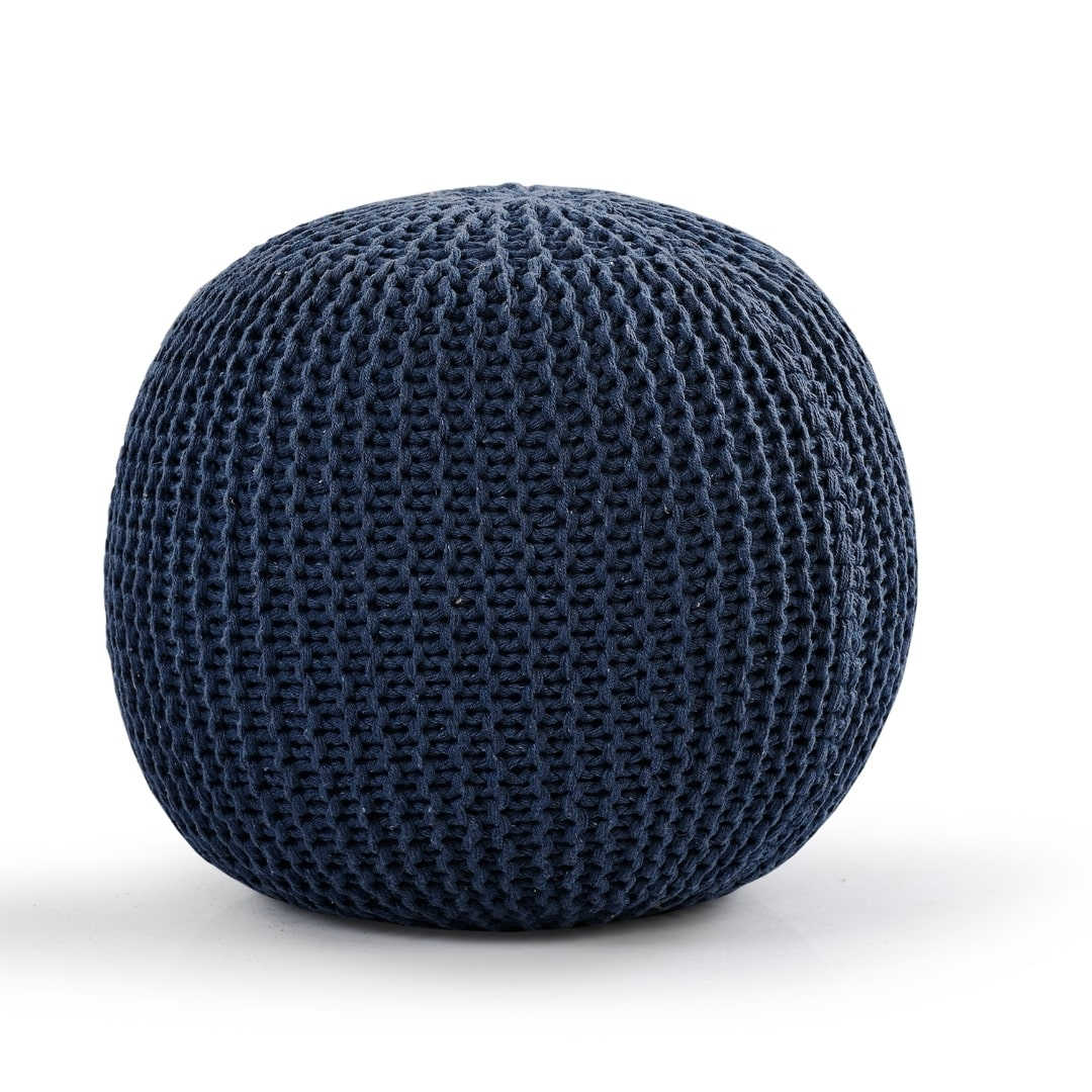 Against a white background, the Blue Knitted Pouf, a navy blue ottoman made from cotton, available at Sukham Home, a sustainable furniture, kitchen & dining and home decor store in Kolkata, India