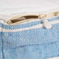 Close up of the zipper of the Geometric Details Blue Pouf, an ottoman made from cotton, available at Sukham Home, a sustainable furniture, kitchen & dining and home decor store in Kolkata, India