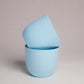 Two blue Verona, a round colourful indoor planter made from plastic that you can buy online at Sukham Home, a sustainable furniture, gardening and home decor store in Kolkata, India