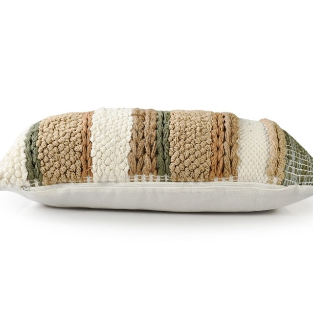 Side view of the Boho Woven Cushion, a rectangle green, white and brown accent pillow available at Sukham Home, a sustainable furniture, kitchen & dining and home decor store in Kolkata, India