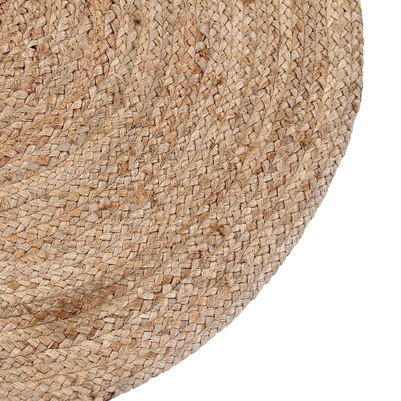 Close up of the corners and weaving pattern of the Braided Round Jute Rug, a circular jute carpet you can buy online at Sukham Home, a sustainable furniture, kitchen & dining and home decor store in Kolkata, India