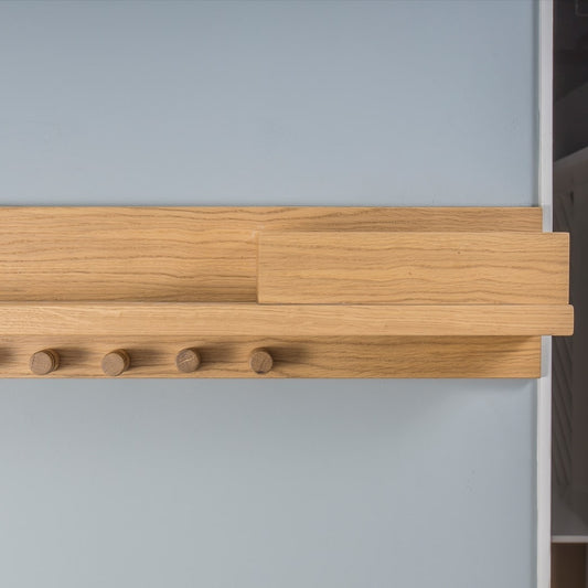 Front view of the hooks and shelf of Clasp, a wooden entryway coat hanger with a shelf and hooks you can buy online at Sukham Home, a sustainable furniture, kitchen & dining and home decor store in Kolkata, India