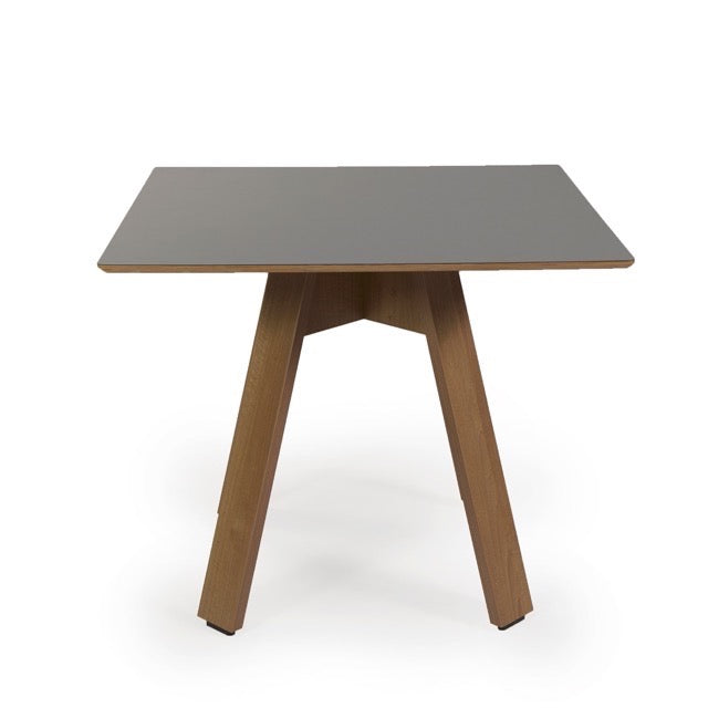 Against a white background, the side view of the Como, a wooden square table you can buy online at Sukham Home, a sustainable furniture, kitchen & dining and home decor store in Kolkata, India