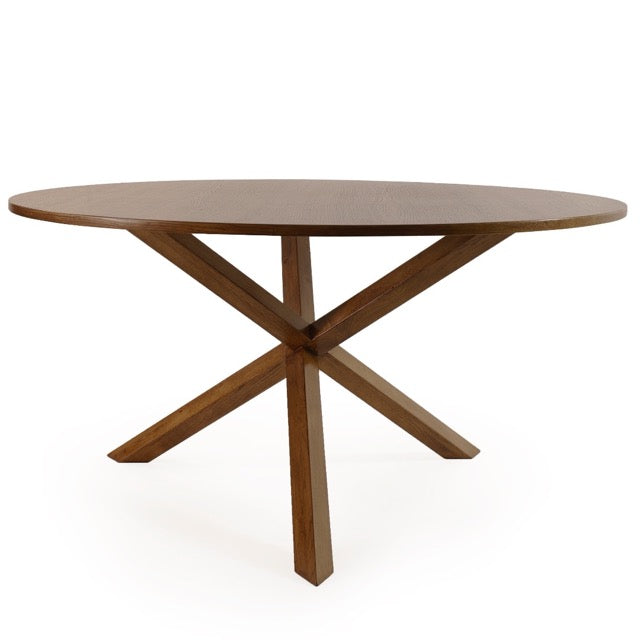 Against a white background, tilted view of the Compass, a wooden round dining table you can buy online at Sukham Home, a sustainable furniture, kitchen & dining and home decor store in Kolkata, India