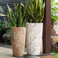 White Italian Marble and Brown Italian Marble finishes in the Cono, a large round tall textured luxury planter made from FRP you can buy online at Sukham Home, a sustainable furniture, gardening and home decor store in Kolkata, India