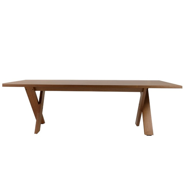 Against a white background, length view of the Walnut Natural Cross, a wooden long dining table you can buy online at Sukham Home, a sustainable furniture, kitchen & dining and home decor store in Kolkata, India