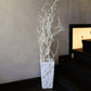 In White Italian Marble finish, the Cubico, a large square tall textured luxury planter made from FRP you can buy online at Sukham Home, a sustainable furniture, gardening and home decor store in Kolkata, India