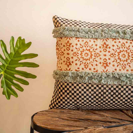 Close up of the textured detailing on the Elysian Fringed Cushion, a rectangle handpainted and tufted accent pillow you can buy online at Sukham Home, a sustainable furniture, kitchen & dining and home decor store in Kolkata, India