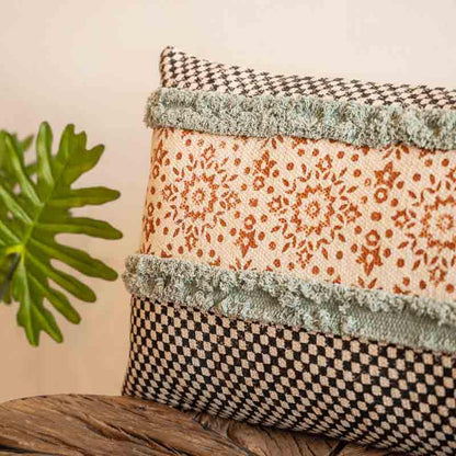 Detailed view of the green tufting and fringed on the Elysian Fringed Cushion, a rectangle handpainted and tufted accent pillow you can buy online at Sukham Home, a sustainable furniture, kitchen & dining and home decor store in Kolkata, India