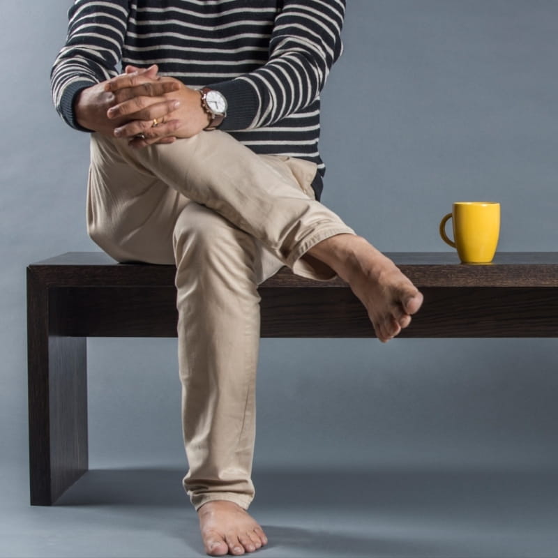 Used as a seating, the Ash Grey Ever Bench, a solid wood dining seat you can buy online at Sukham Home, a sustainable furniture and home decor store in Kolkata, India