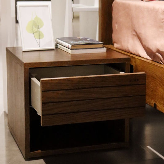 With the drawer open, the Facile, a wooden bedside table with a slatted drawer and cubby storage you can buy online at Sukham Home, a sustainable furniture, kitchen & dining and home decor store in Kolkata, India