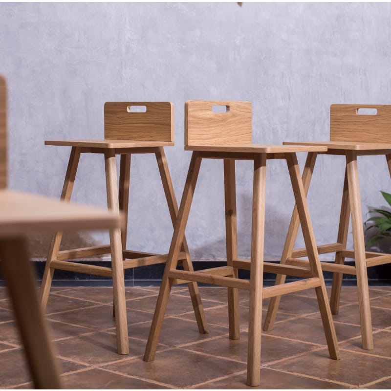 Three Oak Natural Flamingo Bar Stool, a solid wood high bar chair you can buy online at Sukham Home, a sustainable furniture and home decor store in Kolkata, India