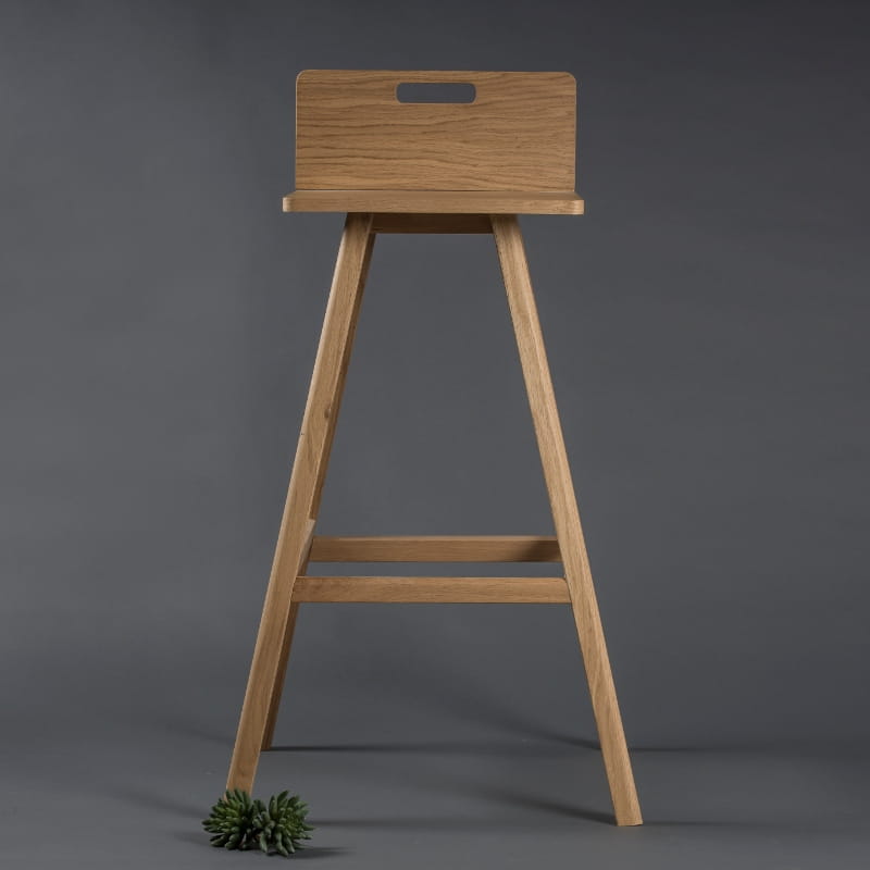 Front view of the Oak Natural Flamingo Bar Stool, a solid wood high bar chair you can buy online at Sukham Home, a sustainable furniture and home decor store in Kolkata, India