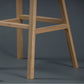 Foot rest of the Flamingo Bar Stool, a solid wood high bar chair you can buy online at Sukham Home, a sustainable furniture and home decor store in Kolkata, India