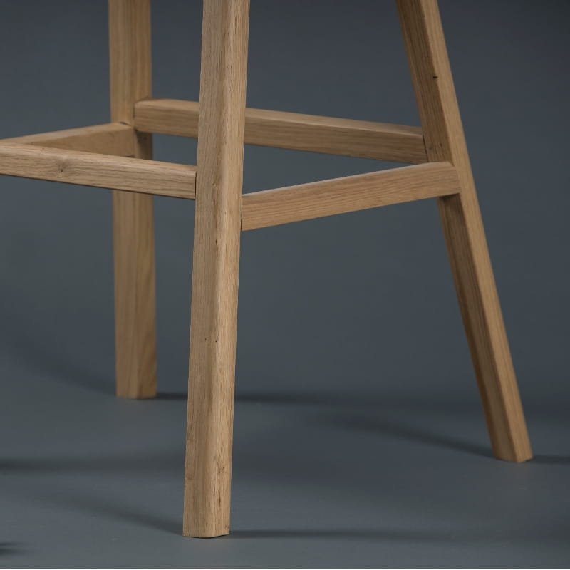 Foot rest of the Flamingo Bar Stool, a solid wood high bar chair you can buy online at Sukham Home, a sustainable furniture and home decor store in Kolkata, India