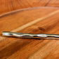 Bottom sculpted design and texture of the Forged Wonder flatware set of stainless steel cutlery you can buy online at Sukham Home, a sustainable furniture, kitchen & dining and home decor store in Kolkata, India