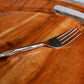 Dinner fork of the Forged Wonder flatware set of stainless steel cutlery you can buy online at Sukham Home, a sustainable furniture, kitchen & dining and home decor store in Kolkata, India