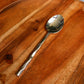 Dinner spoon of the Forged Wonder flatware set of stainless steel cutlery you can buy online at Sukham Home, a sustainable furniture, kitchen & dining and home decor store in Kolkata, India