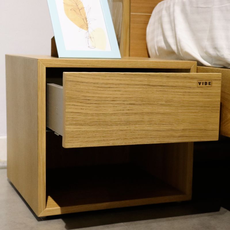 Drawer open of the Oak Natural Fred, a wooden bedside table with a drawer and cubby storage you can buy online at Sukham Home, a sustainable furniture, kitchen & dining and home decor store in Kolkata, India