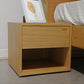 Oak Natural Fred, a wooden bedside table with a drawer and cubby storage you can buy online at Sukham Home, a sustainable furniture, kitchen & dining and home decor store in Kolkata, India