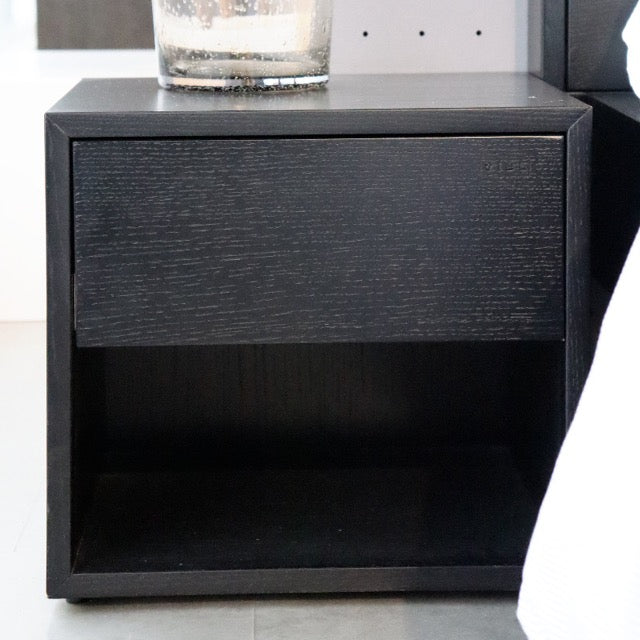 Front view of the Ash Charcoal Fred, a wooden bedside table with a drawer and cubby storage you can buy online at Sukham Home, a sustainable furniture, kitchen & dining and home decor store in Kolkata, India