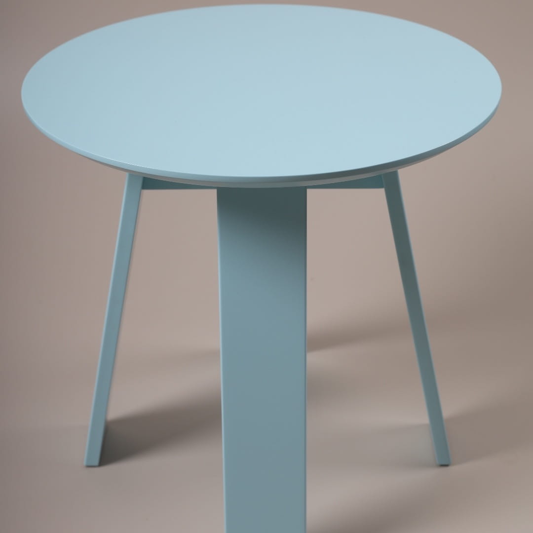 In Serenity Blue, the Full Moon Centre Table, a round wooden coffee and centre table you can buy online at Sukham Home, a sustainable furniture, kitchen & dining and home decor store in Kolkata, India