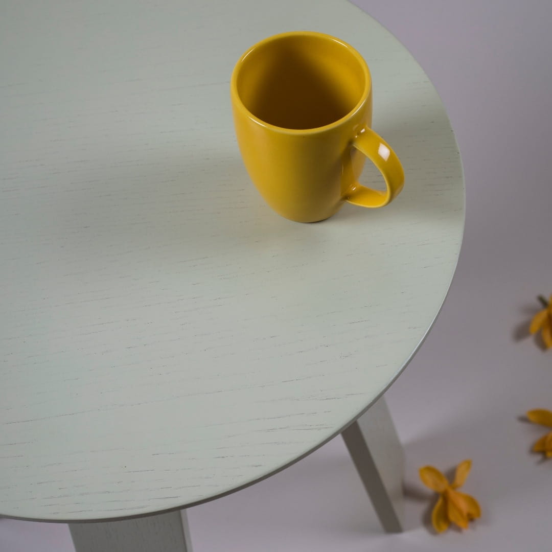 From the top view the Full Moon Centre Table, a round wooden coffee and centre table you can buy online at Sukham Home, a sustainable furniture, kitchen & dining and home decor store in Kolkata, India