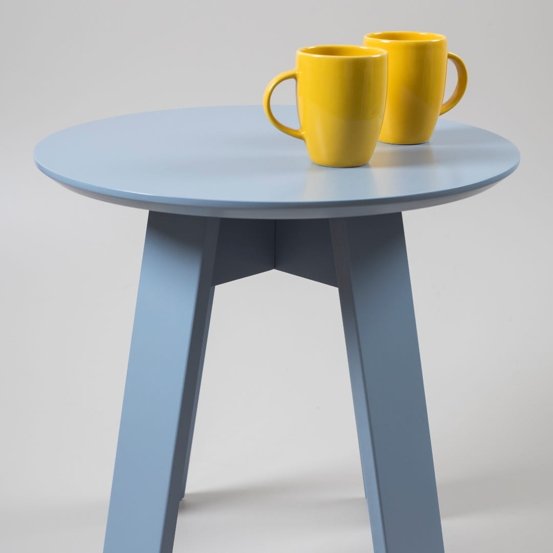 Side view of the Stormy Grey Full Moon Centre Table, a round wooden coffee and centre table you can buy online at Sukham Home, a sustainable furniture, kitchen & dining and home decor store in Kolkata, India