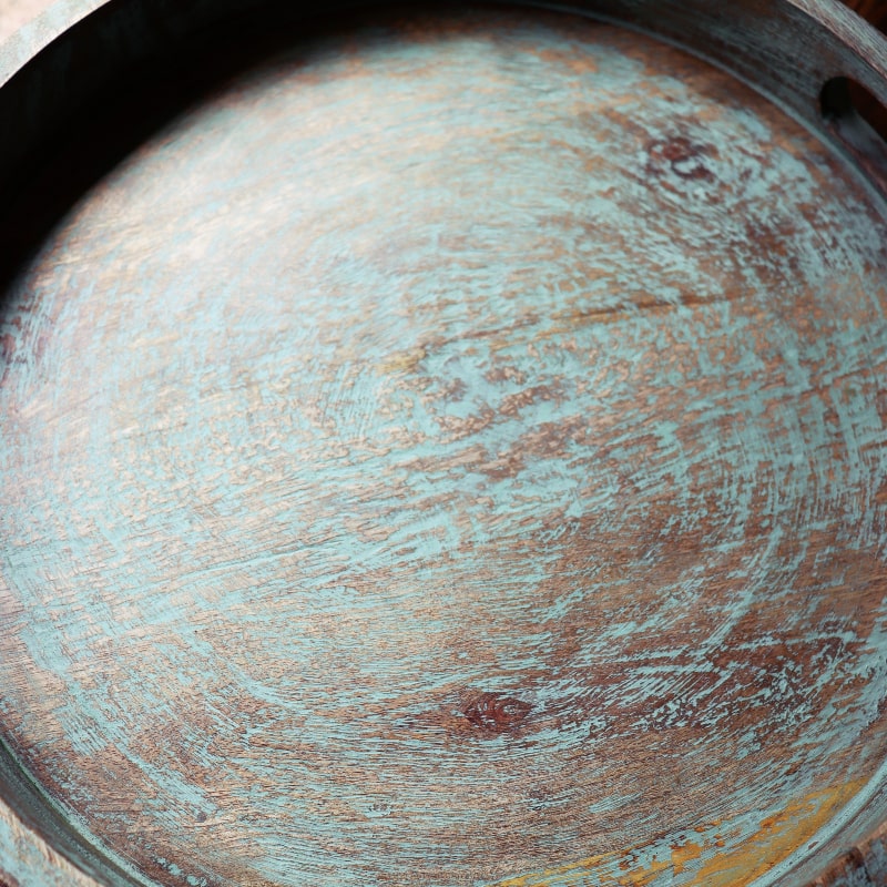 Close up of the texture of the Gangtok Sage Wooden Tray, a solid wood patina green platter and serve ware you can buy online at Sukham Home, a sustainable furniture, kitchen & dining and home decor store in Kolkata, India