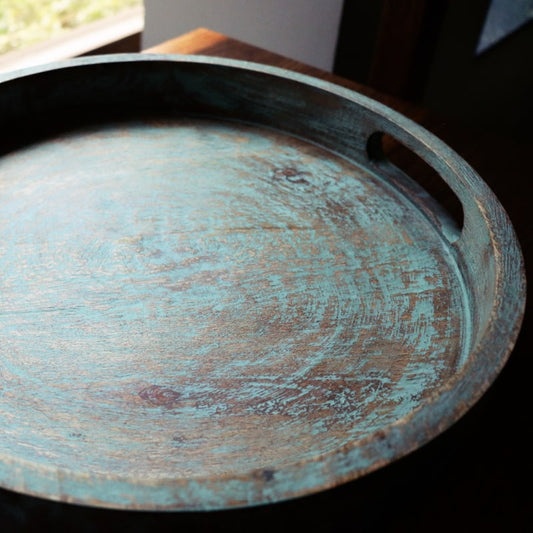 Handle view of the Gangtok Sage Wooden Tray, a solid wood patina green platter and serve ware you can buy online at Sukham Home, a sustainable furniture, kitchen & dining and home decor store in Kolkata, India