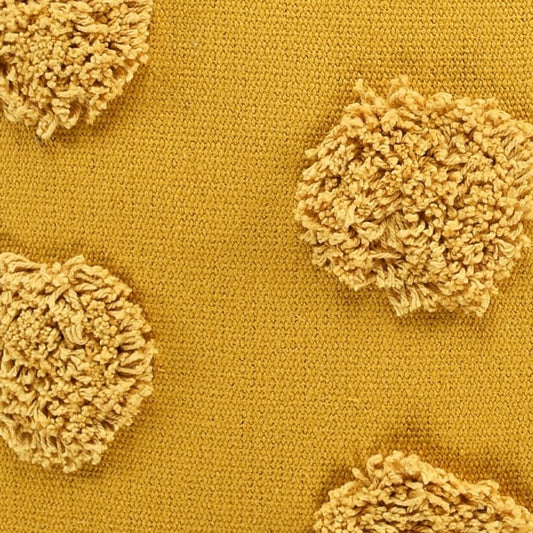 Close up of the tufted polka dot pattern on the the Gold Tufted Dots Cushion, a square yellow accent pillow available at Sukham Home, a sustainable furniture, kitchen & dining and home decor store in Kolkata, India