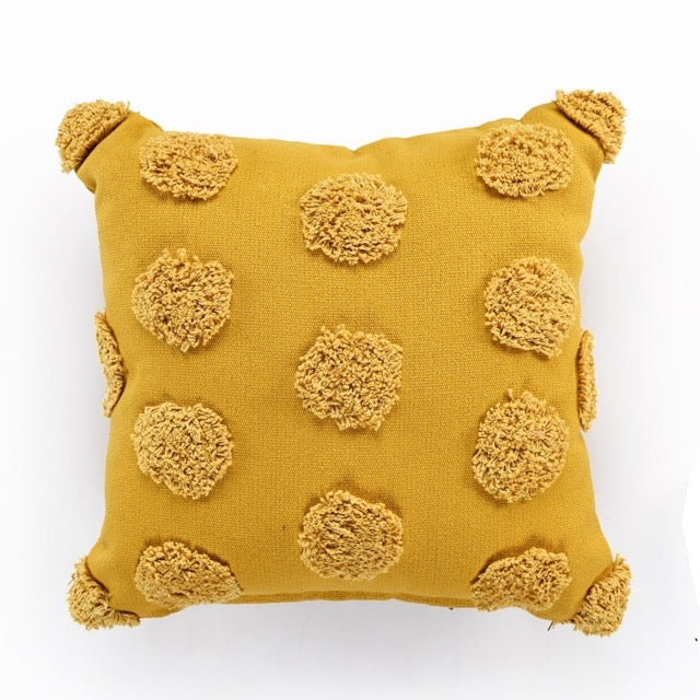 Against a white background, the Gold Tufted Dots Cushion, a square yellow accent pillow available at Sukham Home, a sustainable furniture, kitchen & dining and home decor store in Kolkata, India