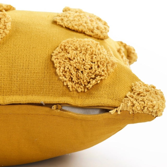 Close up of the zipper of the Gold Tufted Dots Cushion, a square yellow accent pillow available at Sukham Home, a sustainable furniture, kitchen & dining and home decor store in Kolkata, India