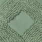 Close up of the tufting pattern of the Green Loop Tufted Cushion, a square green accent pillow available at Sukham Home, a sustainable furniture, kitchen & dining and home decor store in Kolkata, India