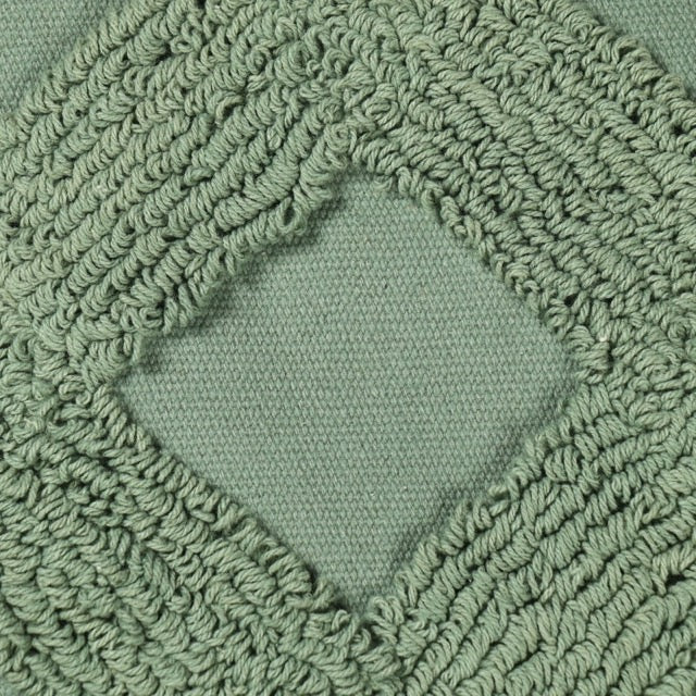 Close up of the tufting pattern of the Green Loop Tufted Cushion, a square green accent pillow available at Sukham Home, a sustainable furniture, kitchen & dining and home decor store in Kolkata, India