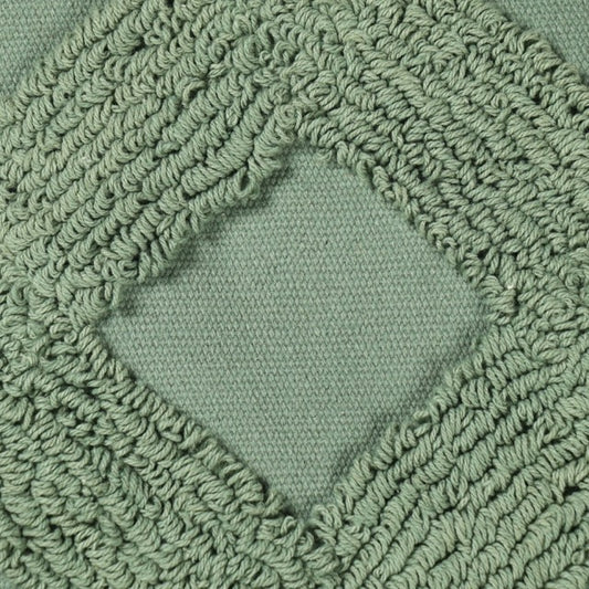 Close up of the tufting pattern of the Green Loop Tufted Cushion, a square green accent pillow available at Sukham Home, a sustainable furniture, kitchen & dining and home decor store in Kolkata, India