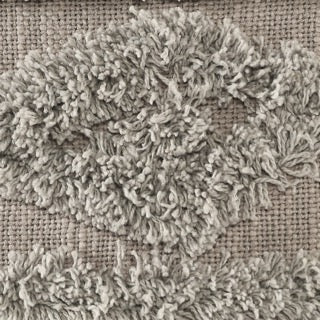 Close up of the tufting pattern of the Grey Diamond Tufted Cushion, a square grey accent pillow available at Sukham Home, a sustainable furniture, kitchen & dining and home decor store in Kolkata, India