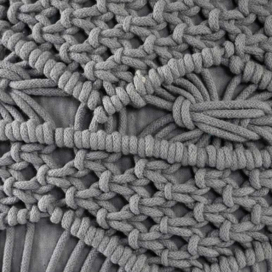 Close up of the texture and design of the Grey Macrame Pouf, a grey ottoman made from cotton, available at Sukham Home, a sustainable furniture, kitchen & dining and home decor store in Kolkata, India