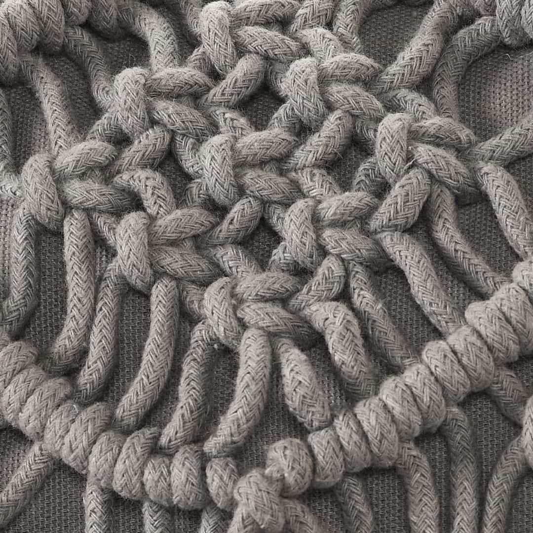 Close up of the design and texture of the Grey Macrame Cushion with Fringes, a rectangle accent pillow you can buy online at Sukham Home, a sustainable furniture, kitchen & dining and home decor store in Kolkata, India