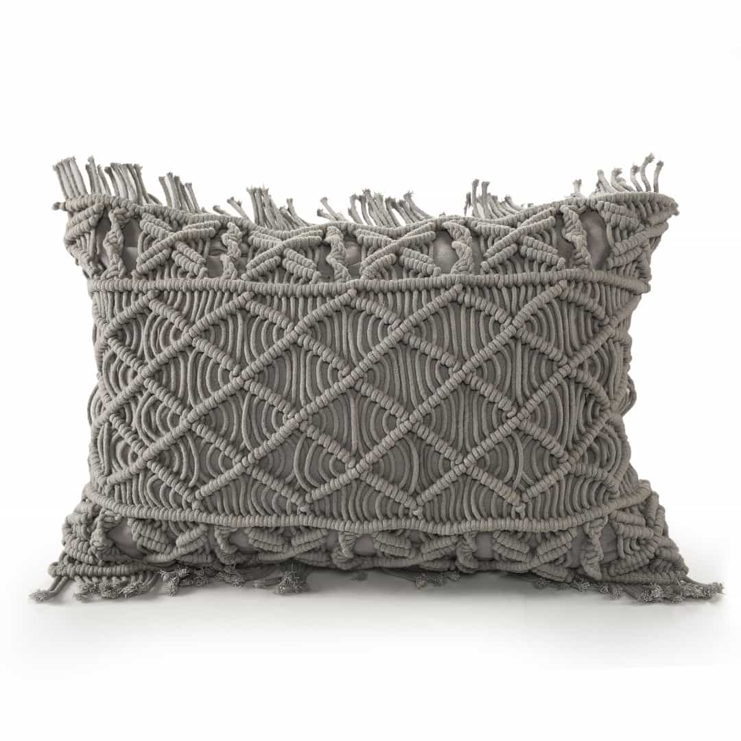 Against a white background, the Grey Macrame Cushion, a rectangle accent pillow you can buy online at Sukham Home, a sustainable furniture, kitchen & dining and home decor store in Kolkata, India