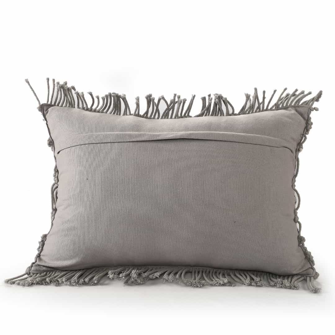 Against a white background, the back of the Grey Macrame Cushion, a rectangle accent pillow you can buy online at Sukham Home, a sustainable furniture, kitchen & dining and home decor store in Kolkata, India