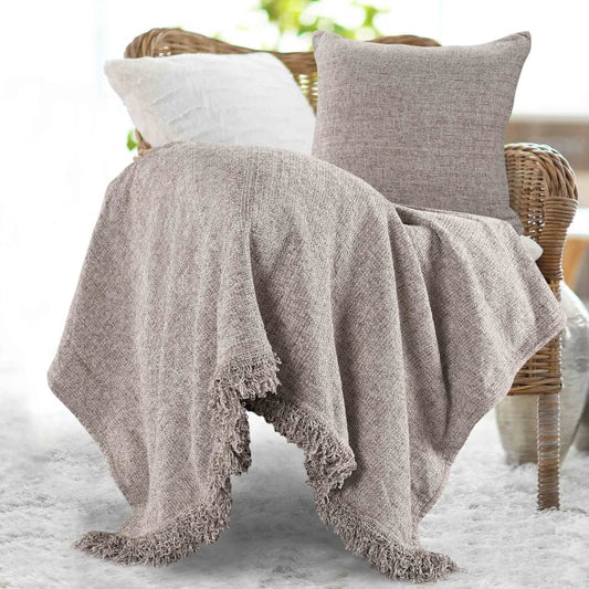 Placed on a chair, the Grey Soft Chenille Throw with Cushion Cover you can buy online at Sukham Home, a sustainable furniture, kitchen & dining and home decor store in Kolkata, India