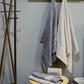 Whole set of the Grey & Beige Silly-Cuddly, a set of 8 floral embroidered towels you can buy online at Sukham Home, a sustainable furniture, kitchen & dining and home decor store in Kolkata, India