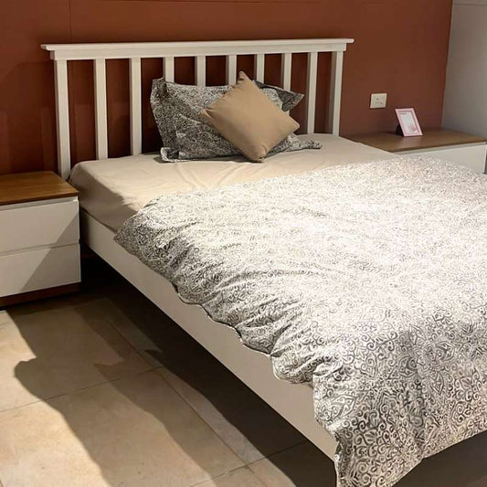 In white PU finish, the Ingrid Bed, a wooden mission-style headboard king and queen size bed you can buy online at Sukham Home, a sustainable furniture, kitchen & dining and home decor store in Kolkata, India